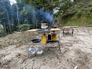 Discover the Campingmoon IGT Grill Table with stainless steel construction and triple-tier design, including a storage bag for easy portability. Perfect for camping trips or backyard BBQs.