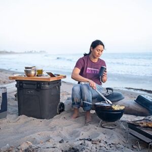 Stay cool on the go with the Roadie 48 Wheeled Cooler featuring a retractable periscope handle and large storage capacity, perfect for camping trips or tailgating events.