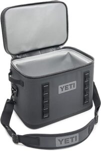 "Stay refreshed on-the-go with the Hopper Flip 18 Portable Soft Cooler, featuring 18-quart capacity and insulated construction for up to 24 hours of ice retention. Perfect for camping trips or beach days!"