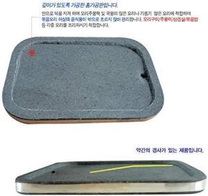 Savor the authentic flavors of Korean cuisine with our traditional stone grill, perfect for BBQ enthusiasts. Cook to perfection with its natural stone surface and grey color.