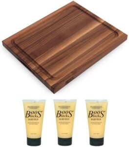 Here is the optimized SEO meta description:

"Elevate your BBQ experience with this John Boos Reversible Walnut Wood Cutting Board featuring a juice groove, perfect for effortless food release. Includes 3-pack of maintenance cream."