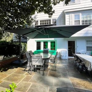 Large patio umbrella with cantilever design and windproof features for outdoor use. Perfect for garden, deck, backyard, or pool areas, measures 12x12 feet, grey color.