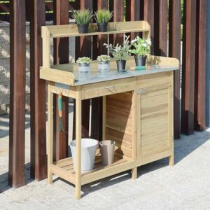 Organize your garden space with Convenience Concepts' Deluxe 1 Drawer Potting Bench featuring storage cabinet and shelves in natural fir design, perfect for small gardening needs.