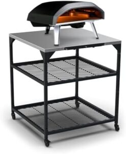"Upgrade your outdoor gatherings with the Ooni Large Modular Table, featuring a stainless steel grill prep cart and pizza oven station. Perfect for BBQs and parties."