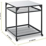 "Upgrade your outdoor gatherings with the Ooni Large Modular Table, featuring a stainless steel grill prep cart and pizza oven station. Perfect for BBQs and parties."