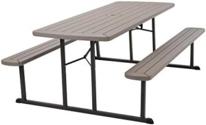 "Unfold outdoor fun with the COSCO 6 ft. folding picnic table, featuring taupe wood grain and brown legs, perfect for casual gatherings and backyard events."