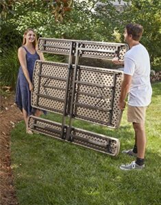 "Unfold outdoor fun with the COSCO 6 ft. folding picnic table, featuring taupe wood grain and brown legs, perfect for casual gatherings and backyard events."