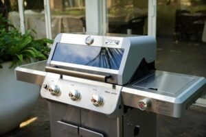 Here is the optimized meta description:

"Upgrade your outdoor cooking experience with Monument Grills' 3-burner propane gas grill featuring a side burner, smoker box and knob controls. Perfect for patio gatherings, this stainless steel grill delivers 48,000 BTUs of cooking power."