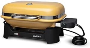 Discover the Weber Lumin Compact Outdoor Electric Barbecue Grill, perfect for small spaces like patios, balconies, and decks. Portable and convenient, this yellow grill is ideal for outdoor cooking.