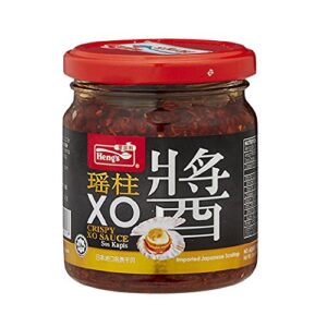 Discover Heng's Crispy XO Sauce, a delicious 12-count pack of 180g bottles. Perfect for flavoring your favorite dishes, with a crunchy texture and savory taste.