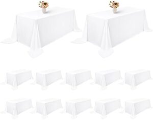 Protect your tables with our durable 12-pack white polyester tablecloths, perfect for weddings, banquets, and parties. Stain and wrinkle resistant, washable fabric ensures a professional look all event long.