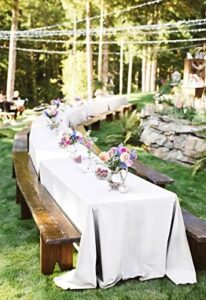 Protect your tables with our durable 12-pack white polyester tablecloths, perfect for weddings, banquets, and parties. Stain and wrinkle resistant, washable fabric ensures a professional look all event long.