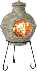 Enrich your outdoor gatherings with this Indoor/Outdoor Beige Clay Chimenea BBQ Grill Fire Pit, featuring a metal stand for stability and accent design for a stylish ambiance.