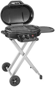 Here is the optimized meta description:

"Portable propane grill Coleman RoadTrip 225 with push-button start, foldable legs & wheels, side table and 11k BTUs for outdoor grilling adventures. Perfect for camping trips or backyard BBQs."
