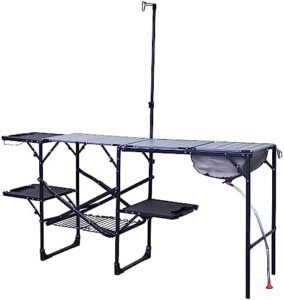 Elevate your camping experience with the GCI OUTDOOR Master Cook Station: a portable folding kitchen table featuring a soft shell sink, heat-resistant tabletop, and telescoping lantern pole. Perfect for outdoor adventures!