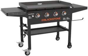 Cook up a culinary masterpiece on the Blackstone 2266 36" Original Omnivore Griddle, featuring dual side shelves and powder-coated steel for effortless cooking. Perfect for big meals and backyard gatherings. Get ready to sizzle!