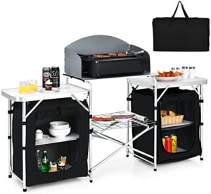 Discover the ultimate camping companion: Tangkula's 2-Tier Aluminum Folding Table with Windscreen, cook station & storage. Perfect for picnics, BBQs, or parties!
