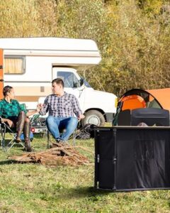 "Upgrade your outdoor cooking experience with the KingCamp Bamboo Camp Kitchen Station, featuring a folding design and adjustable lantern pole. Perfect for camping, tailgating, or BBQs, this portable kitchen table includes hooks for windshield storage and a windscreen organizer."