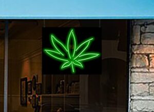 Illuminate your space with the Hemp Leaf Neon Sign, a unique 30" wide x 24" high handmade piece featuring a green leaf graphic. Perfect for home decor and office spaces!