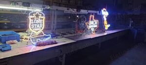 "Add a touch of wild outdoors to your space with the Miller High Life neon sign, featuring a buck deer design. Perfect for bars, pubs, or man caves, this 24x20inch glass lamp with neon tubing lighting adds a unique ambiance."