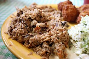Here's your optimized meta description:

"Savor the tender, smoky flavor of North Carolina-style pulled pork in 10 convenient 1lb tubs. Perfect for BBQ enthusiasts and meal prep fans alike."