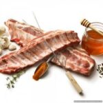 Here is the generated SEO meta description:

"Savor the tender, all-natural taste of these imported Danish baby back ribs, slow-cooked to perfection with no artificial preservatives or additives."