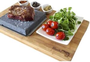 Cook sizzling steaks to perfection with the Black Rock Grill Steak On The Stone Set. Includes hot rock grill table top lava cooking stone for a unique grilling experience.