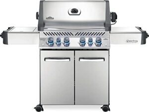 "Savor the taste of perfection with Napoleon's P500RSIBPSS-3 Prestige 500 gas grill, featuring infrared side and rear burners, stainless steel construction, and 425 sq. in cooking area. Limited-time discounts available for this top-rated propane grill."