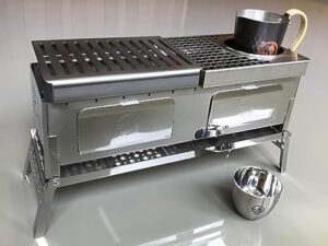 Master the art of sizzling hot meals with Sho's B-VI-DUO Compact Hibachi Grill set, featuring a foldable hibachi, sake warm plate, carafe, and cup. Perfect for outdoor cooking, ideal for 2-3 people.