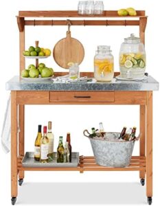 "Maximize your outdoor entertaining space with this versatile table and storage cabinet featuring a stainless steel top, 4 locking wheels, and grill accessory hooks. Perfect for patio kitchens or bar carts, dimensions: 30x24.5x37.5 inches."