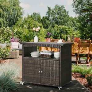 Discover the perfect outdoor storage cabinet for your patio bar cart, featuring rolling wheels, shelves, and a handle. Store and serve with ease in this brown wicker buffet cabinet.