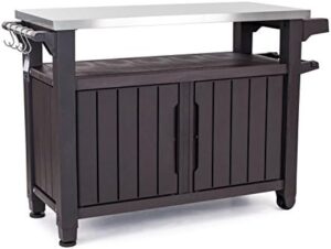 Perfect your outdoor gatherings with the Outdoor Rolling Table Cart, featuring a dark brown tabletop with wheels for easy transport. Store food, drinks, and snacks in its spacious interior.