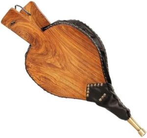 Enhance your outdoor gatherings with the Lodge Fireplace Bellows, featuring a durable hardwood and leather handheld air blower with a brass nozzle. Perfect for indoor or outdoor fireplaces, BBQs, and campfires, this black and brass design offers a reliable wood fire starter.