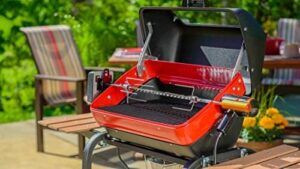 Savor outdoor cooking with Americana's Rotisserie Electric Grill, featuring a spacious shelf for extra storage. Enjoy slow-cooked meals and effortless grilling, perfect for family gatherings and BBQs.