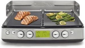 Sear and sizzle indoors with the GreenPan Elite XL Smoke-less Grill and Griddle, featuring healthy ceramic nonstick cast aluminum plates and interchangeable compartments. Perfect for indoor BBQs, this model includes LCD display, splash guard, drip tray, and PFAS-free construction.