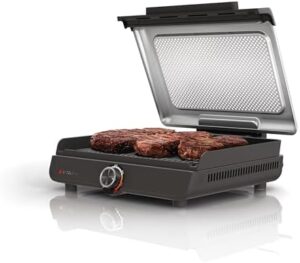 Here is the optimized SEO meta description:

"Upgrade your indoor grilling with the Ninja GR101 Sizzle Smokeless Indoor Grill & Griddle, featuring interchangeable nonstick plates and a dishwasher-safe lid. Enjoy even edge-to-edge cooking and reach high temperatures of 500F."