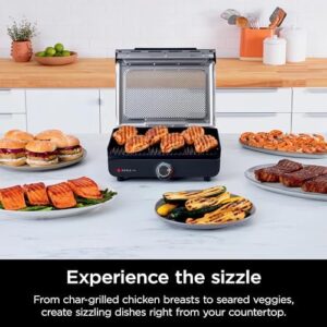 Here is the optimized SEO meta description:

"Upgrade your indoor grilling with the Ninja GR101 Sizzle Smokeless Indoor Grill & Griddle, featuring interchangeable nonstick plates and a dishwasher-safe lid. Enjoy even edge-to-edge cooking and reach high temperatures of 500F."