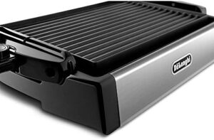Experience the perfect cooking combination with De'Longhi's BGR50 Reversible Grill/Griddle, ideal for indoor/outdoor use, featuring 2 heat zones and adjustable height. Get ready to sizzle!