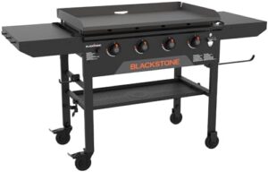Cook up a storm on your patio or backyard with the Blackstone 2210 Original 36” Omnivore Griddle featuring two side shelves and powder coated steel for durable use. Perfect for camping trips or family gatherings, this griddle offers ample cooking space and versatile design.